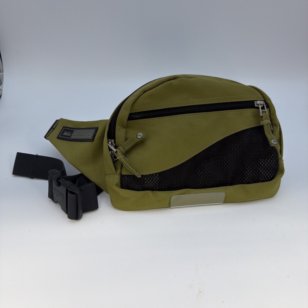 REI Co-op olive green belt bag featuring a front mesh pocket